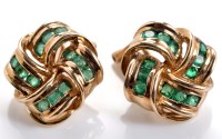 Lot 823 - A pair of emerald knot pattern earrings, set...