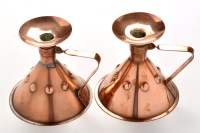 Lot 834 - Liberty & Co: a pair of copper chamber...