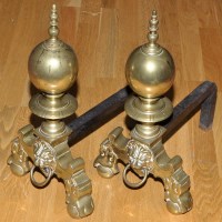 Lot 841 - A pair of 19th Century brass andirons, with...