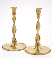 Lot 859 - A pair of 18th Century brass candlesticks, the...