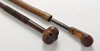 Lot 899 - Two African clubs, one with turned wood head...