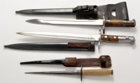 Lot 915 - A German WWII Mauser bayonet, with scabbard...