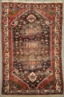 Lot 1124 - A Bakhtiari rug, the central field decorated...