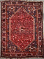 Lot 1128 - A Qashqai carpet, the central claret field...