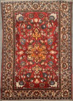 Lot 1130 - An Isfahan rug, the claret ground decorated...