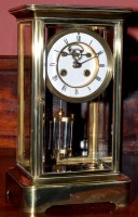 Lot 1160 - A brass four glass mantel clock, late...