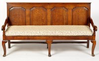 Lot 1170 - A late 18th Century oak settle, the arched...