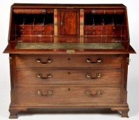 Lot 1174 - A George III mahogany bureau, the fall flap...