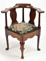 Lot 1186 - A George II mahogany corner chair, the shaped...