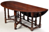 Lot 1192 - An 18th Century style oak wake table, the oval...