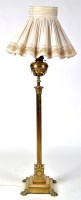 Lot 1204 - A Victorian brass standard lamp, fitted cream...