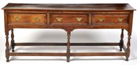 Lot 1208 - An 18th Century oak dresser, fitted three...