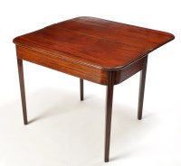 Lot 1217 - A late George III mahogany turn-over-top tea...