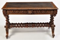 Lot 1218 - A Victorian carved oak library table, the...