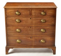 Lot 1240 - A George III mahogany chest, of two short and...