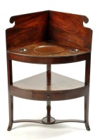 Lot 1242 - A George III mahogany bowfront corner...