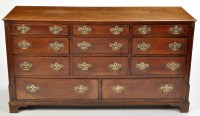 Lot 1243 - A Georgian and later oak dresser, the...