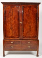 Lot 1255 - A 19th Century Irish mahogany wardrobe on...