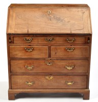 Lot 1262 - A George III mahogany bureau, the fall-flap...