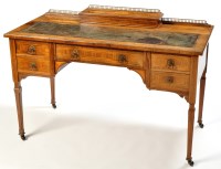 Lot 1268 - An Edwardian inlaid walnut desk, the top with...