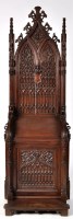 Lot 1279 - A Victorian Gothic revival carved oak...