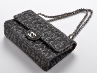 Lot 73A - Chanel: a fabric flap bag, with metal and...