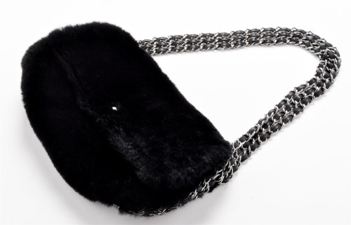 Lot 73 - Chanel: A black rabbit fur handbag, with...