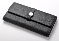 Lot 73C - Hermes: black leather wallet with circular...