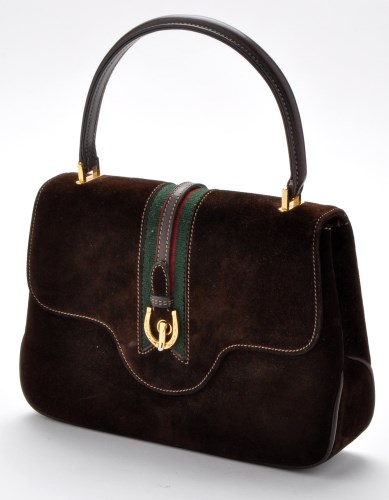 Lot 73 - Gucci: a brown suede handbag, with horseshoe...