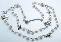 Lot 75 - Chanel: a faux pearl necklace, with metal...