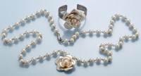 Lot 75B - Chanel: a faux pearl necklace with flower...