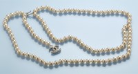 Lot 75C - Chanel: a faux pearl belt, with monogram drop,...