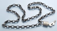 Lot 75D - Chanel: chain and padlock belt, patinated...