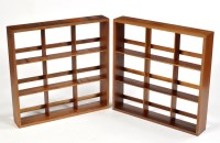 Lot 94 - A pair of post war design teak wall shelves,...