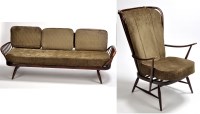 Lot 125 - Ercol: a brown stained teak settee, the...