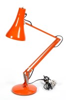 Lot 132 - A bright orange coloured anglepoise lamp;...