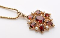 Lot 913 - A garnet and seed pearl snowflake pattern drop...