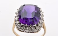 Lot 915 - An amethyst and diamond cluster ring, the oval...