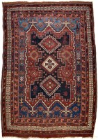 Lot 994 - An Afshar rug, with triple diamond medallions...