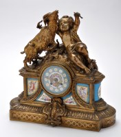 Lot 997 - A French gilt metal mantel clock, the painted...