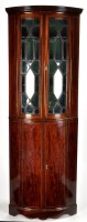 Lot 1051 - A late 19th Century mahogany corner cabinet,...