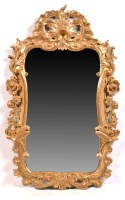 Lot 1053 - A George III giltwood and gesso wall mirror,...