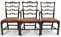 Lot 1061 - A set of Georgian style dining chairs, one arm...