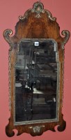 Lot 1068 - A Georgian style walnut wall mirror, of shaped...