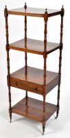 Lot 1080 - A 19th Century four-tier rosewood whatnot,...