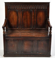 Lot 1083 - An 18th Century style oak box settle, the...