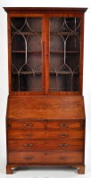 Lot 1085 - A George III mahogany bureau bookcase, the...