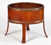 Lot 1090 - An Arts & Crafts coopered oak planter, of oval...