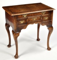 Lot 1097 - A George II style walnut lowboy, the quarter...