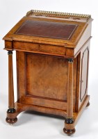 Lot 1099 - A Victorian walnut davenport, the top with...